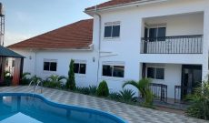 5 bedroom house for salein Bwebajja with a swimming pool at 1.2 billion Uganda shillings