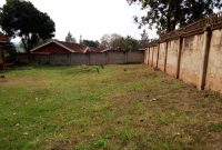 This is a 75 decimals plot of land for sale in Naguru with a shell house right off the main tarmac going for 800,000 USD