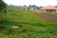 1 acre of fenced up land for sale in Kyanja Kungu at 850m