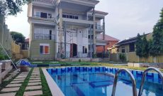 6 bedroom house with a pool for sale in Muyenga at $700,000