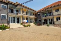 14 units apartment block for sale in Kyanja 10m monthly at 1.3 billion shillings