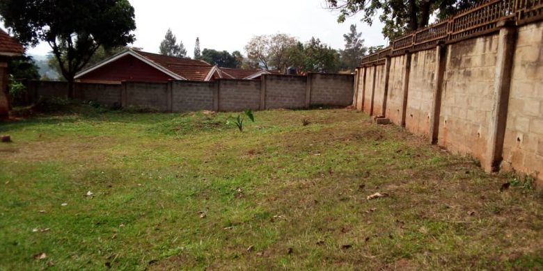 This is a 75 decimals plot of land for sale in Naguru with a shell house right off the main tarmac going for 800,000 USD